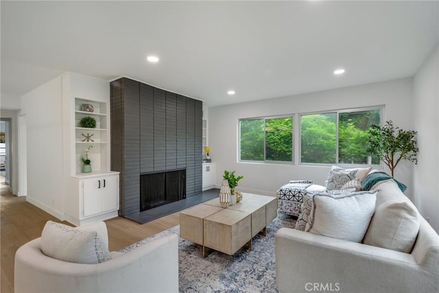 835 S Orange Grove Blvd, Pasadena, CA 91105 - living area with a fireplace, wood finished floors, baseboards, and recessed lighting