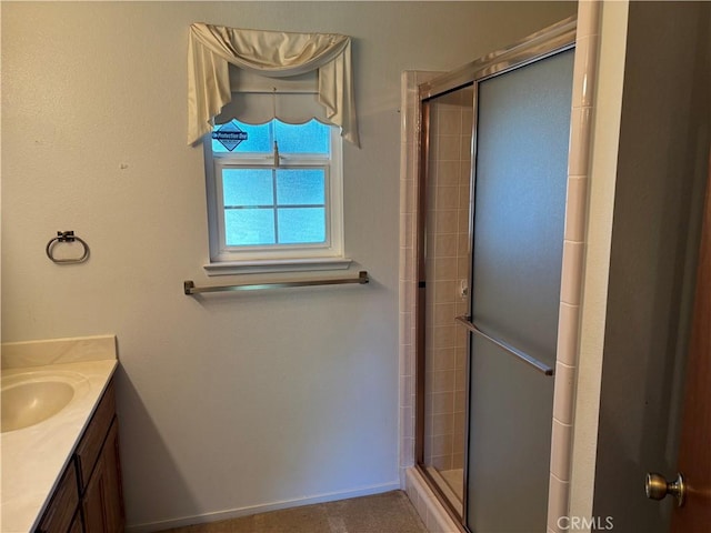 bathroom with vanity and a shower stall