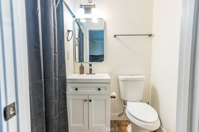 9213 Jacaranda Ave, California City, CA 93505 - full bathroom with vanity, a shower with curtain, and wood finished floors