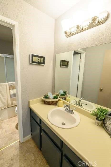 1 Appian Way Unit 710-6, San Francisco, CA 94080 - bathroom with vanity and bath / shower combo with glass door