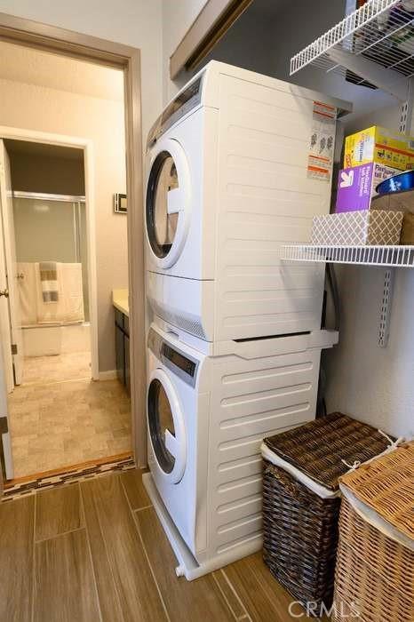 1 Appian Way Unit 710-6, San Francisco, CA 94080 - laundry room featuring stacked washer / drying machine and wood finished floors