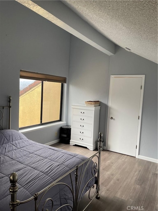 1 Appian Way Unit 710-6, San Francisco, CA 94080 - bedroom featuring vaulted ceiling, a textured ceiling, and wood finished floors