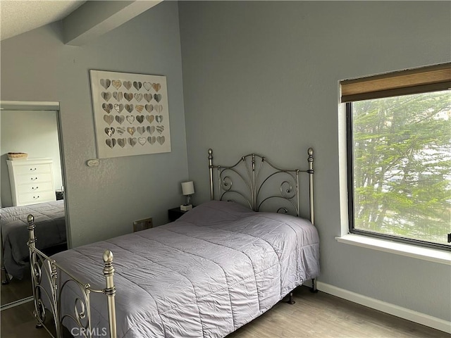 1 Appian Way Unit 710-6, San Francisco, CA 94080 - bedroom with wood finished floors, multiple windows, and vaulted ceiling
