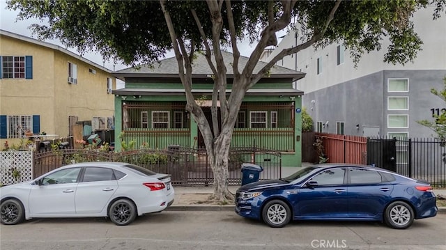 11241126 E 25th St, Los Angeles, CA 90011 - view of front of home featuring fence and a gate