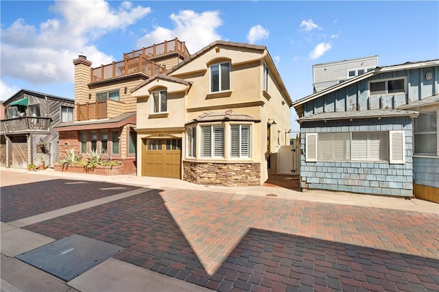56 B Surfside Ave, Surfside, CA 90743 - view of front of house with an attached garage and stucco siding