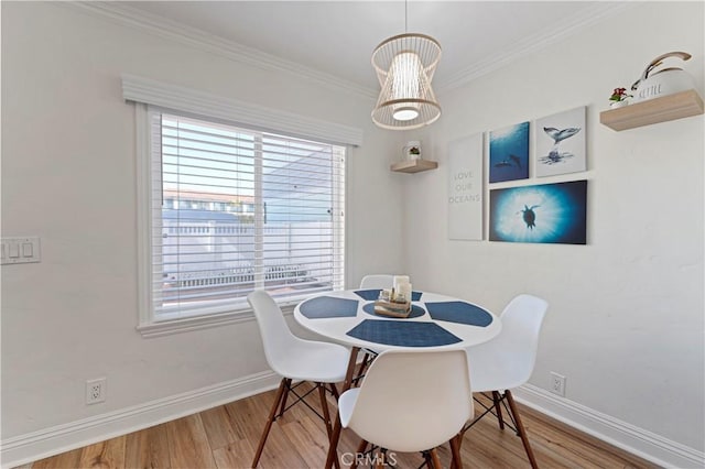 56 B Surfside Ave, Surfside, CA 90743 - dining room with wood finished floors, a wealth of natural light, crown molding, and baseboards