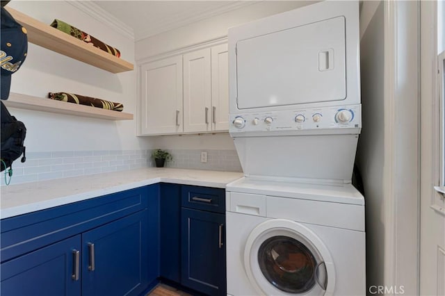 56 B Surfside Ave, Surfside, CA 90743 - laundry room featuring stacked washer and clothes dryer, crown molding, and cabinet space