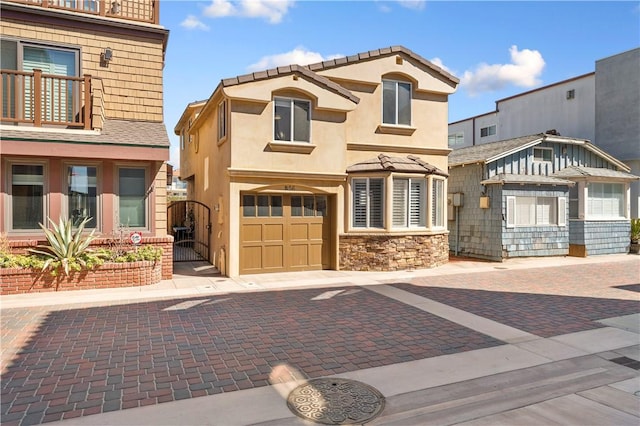 56 B Surfside Ave, Surfside, CA 90743 - view of front of home with a garage, stone siding, and stucco siding