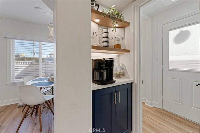 56 B Surfside Ave, Surfside, CA 90743 - bar featuring crown molding, baseboards, light wood finished floors, and a dry bar
