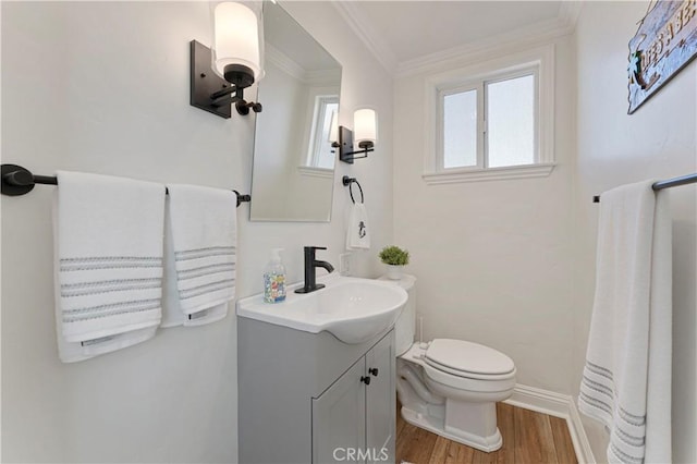 56 B Surfside Ave, Surfside, CA 90743 - bathroom with toilet, baseboards, wood finished floors, vanity, and ornamental molding