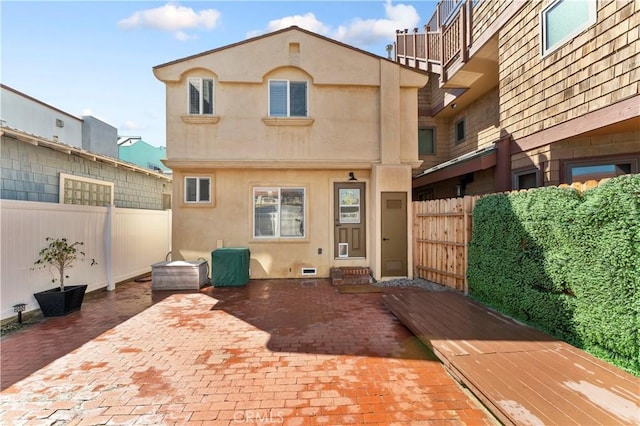 56 B Surfside Ave, Surfside, CA 90743 - back of house featuring a patio area, stucco siding, and fence