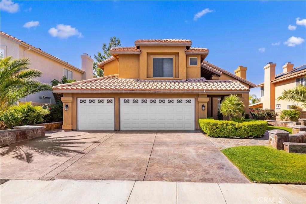 3413 Bellini Way, Palmdale, CA 93551 - mediterranean / spanish house with stucco siding, driveway, and a tiled roof