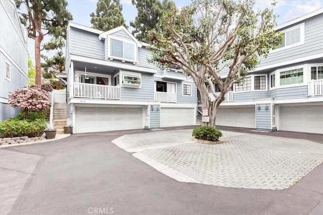 2218 Mayfair Ct, Costa Mesa, CA 92627 - townhome / multi-family property with an attached garage, driveway, and stairs