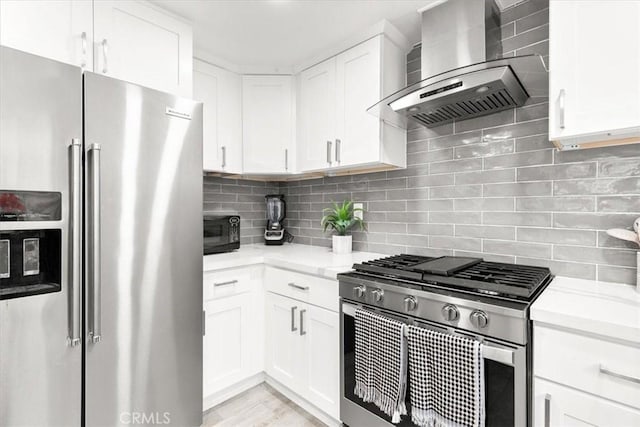 2218 Mayfair Ct, Costa Mesa, CA 92627 - kitchen with appliances with stainless steel finishes, wall chimney range hood, white cabinetry, and backsplash