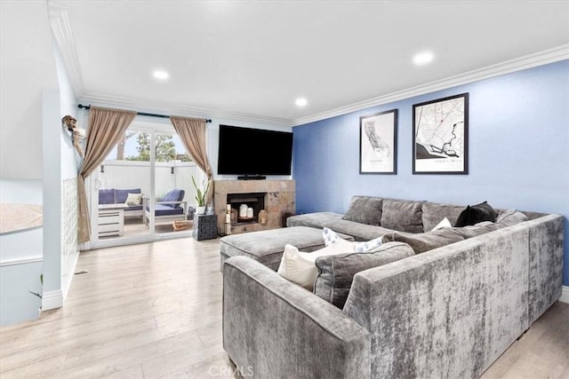 2218 Mayfair Ct, Costa Mesa, CA 92627 - living area featuring crown molding, light wood-type flooring, a fireplace, recessed lighting, and baseboards