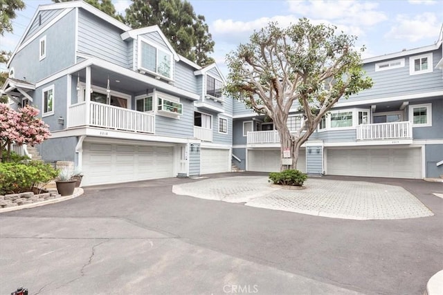 2218 Mayfair Ct, Costa Mesa, CA 92627 - view of property with a garage, driveway, and stucco siding