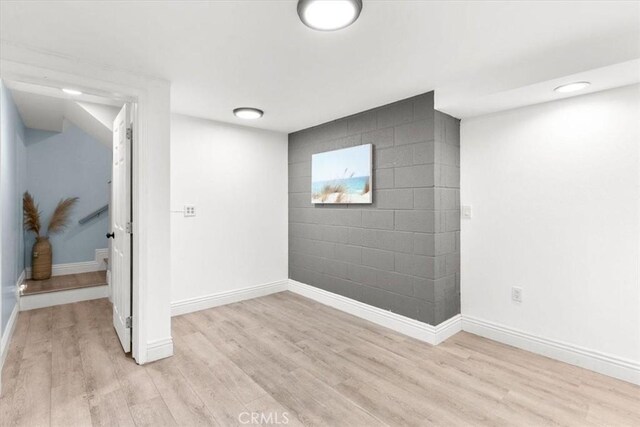 2218 Mayfair Ct, Costa Mesa, CA 92627 - below grade area with light wood finished floors and baseboards