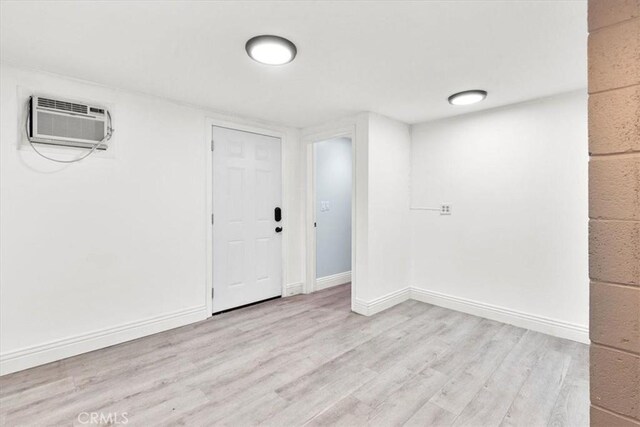 2218 Mayfair Ct, Costa Mesa, CA 92627 - foyer entrance with wood finished floors, a wall mounted air conditioner, and baseboards