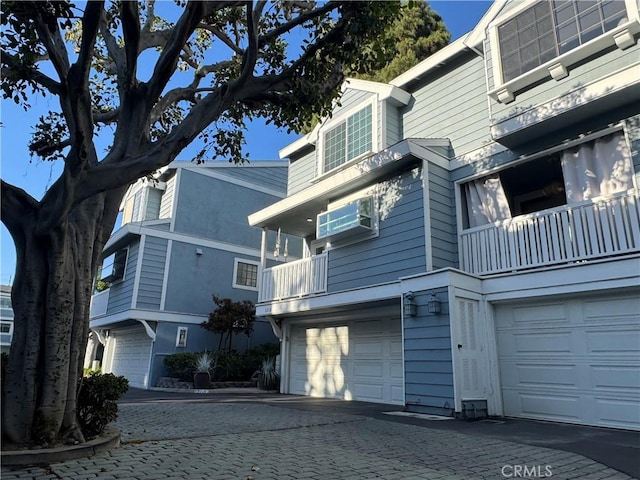 2218 Mayfair Ct, Costa Mesa, CA 92627 - view of building exterior with an attached garage and decorative driveway