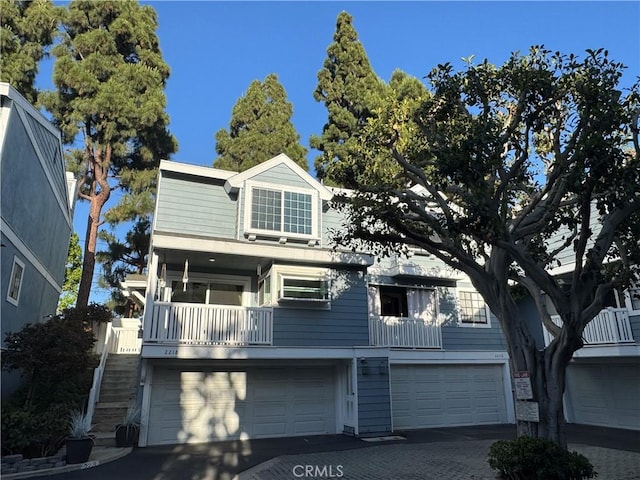 2218 Mayfair Ct, Costa Mesa, CA 92627 - view of front of property featuring an attached garage, driveway, and stairs