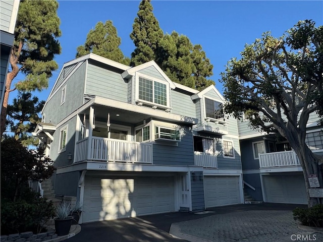 2218 Mayfair Ct, Costa Mesa, CA 92627 - back of house with a garage and driveway