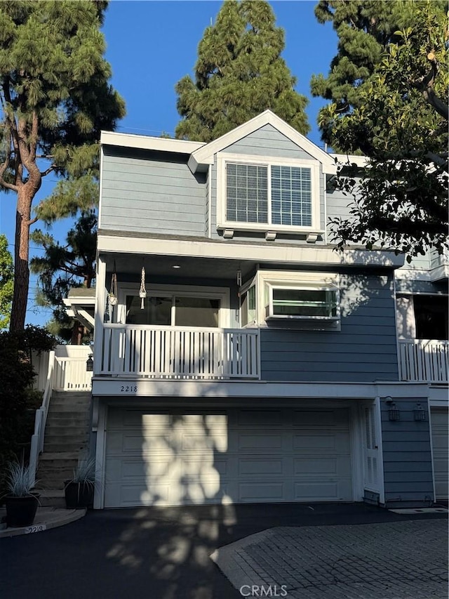 2218 Mayfair Ct, Costa Mesa, CA 92627 - view of front of property with an attached garage, driveway, and stairs