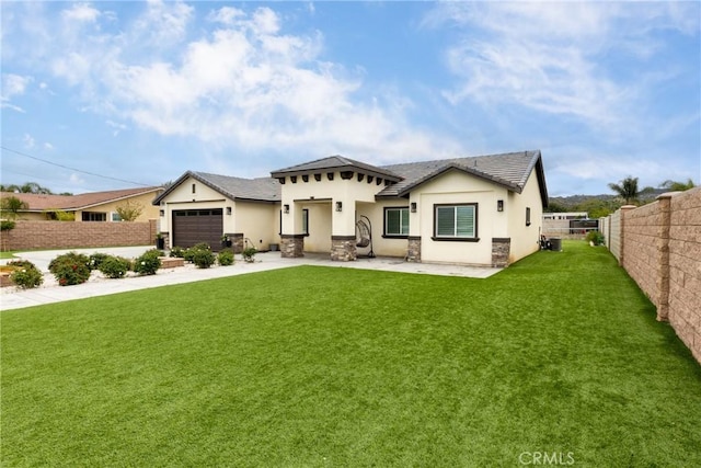 20109 Hunter St, Perris, CA 92570 - view of front facade with a fenced backyard, a front lawn, concrete driveway, stucco siding, and a garage