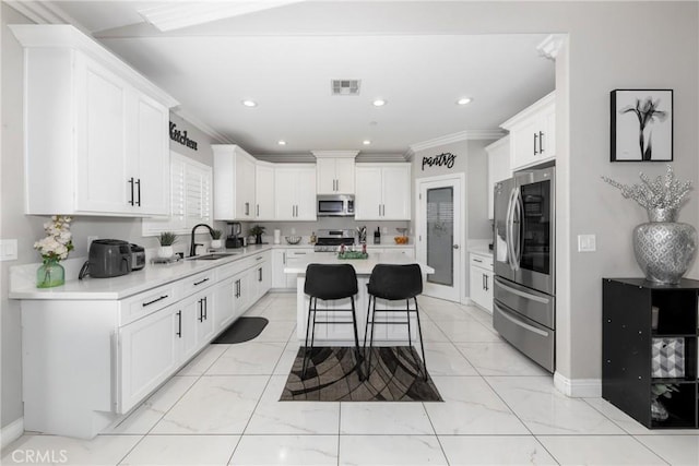 20109 Hunter St, Perris, CA 92570 - kitchen with light countertops, marble finish floor, stainless steel appliances, and a sink