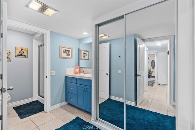 888 Ronda Sevilla Unit D, Laguna Woods, CA 92637 - full bath featuring visible vents, tile patterned flooring, vanity, and a stall shower
