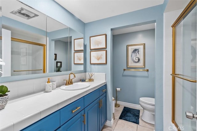 888 Ronda Sevilla Unit D, Laguna Woods, CA 92637 - full bath featuring tile patterned floors, vanity, a shower with door, toilet, and visible vents
