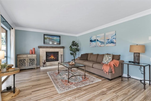 888 Ronda Sevilla Unit D, Laguna Woods, CA 92637 - living room featuring baseboards, ornamental molding, wood finished floors, and a tiled fireplace