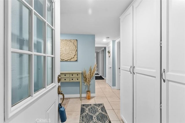 888 Ronda Sevilla Unit D, Laguna Woods, CA 92637 - corridor with baseboards, recessed lighting, and light tile patterned floors