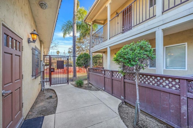 905 E 4th Ave Unit 1, National City, CA 91950 - view of patio / terrace with fence, a gate, and a balcony