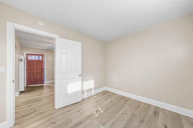 905 E 4th Ave Unit 1, National City, CA 91950 - unfurnished room with baseboards and light wood finished floors