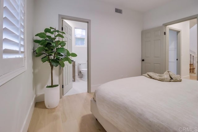 2850 Palmetto Point Ct, Chula Vista, CA 91915 - bedroom with multiple windows, light wood finished floors, and ensuite bath