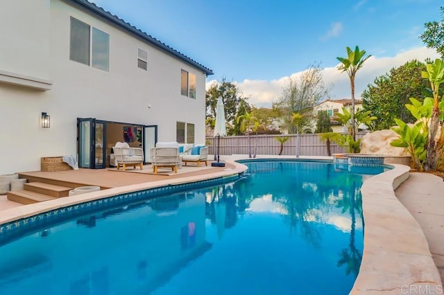 2850 Palmetto Point Ct, Chula Vista, CA 91915 - view of pool with an outdoor hangout area, a fenced backyard, a wooden deck, and a pool with connected hot tub