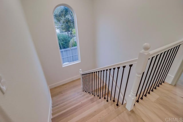 2850 Palmetto Point Ct, Chula Vista, CA 91915 - staircase featuring healthy amount of natural light and wood finished floors