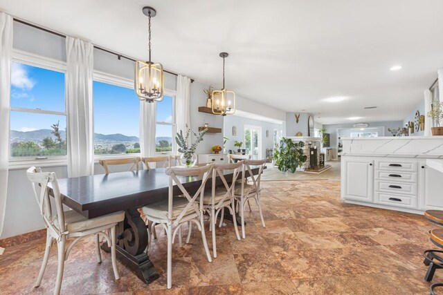 22053 Highland St, Wildomar, CA 92595 - dining room featuring light stone finish floors, a chandelier, and recessed lighting