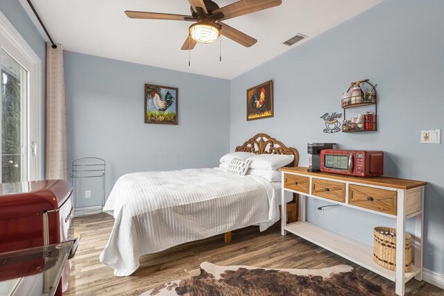 22053 Highland St, Wildomar, CA 92595 - bedroom with wood finished floors and a ceiling fan
