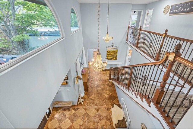 22053 Highland St, Wildomar, CA 92595 - stairs with a chandelier and stone finish flooring