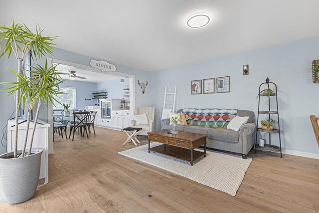 22053 Highland St, Wildomar, CA 92595 - living room featuring light wood finished floors, ceiling fan, and baseboards