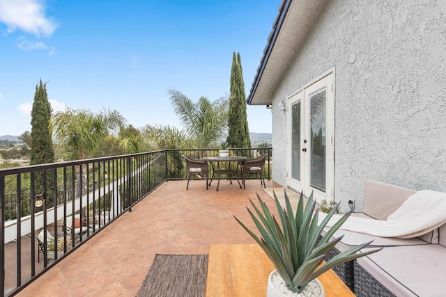 22053 Highland St, Wildomar, CA 92595 - balcony with french doors, a mountain view, and outdoor dining area