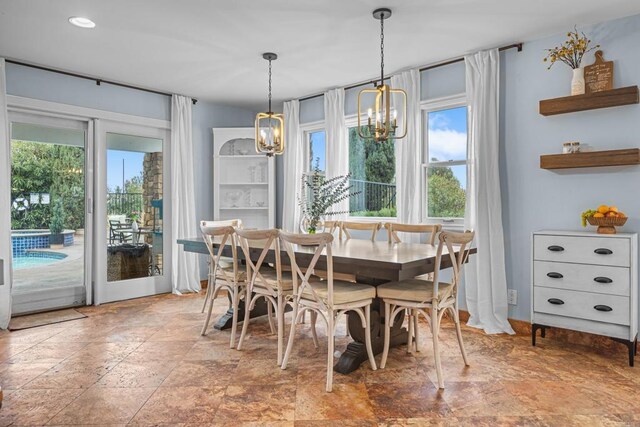 22053 Highland St, Wildomar, CA 92595 - dining room with light stone finish floors and a chandelier