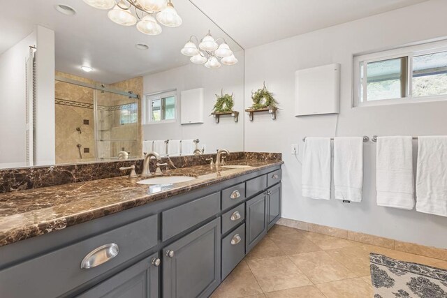 22053 Highland St, Wildomar, CA 92595 - full bathroom featuring healthy amount of natural light, tile patterned flooring, a shower stall, and double vanity