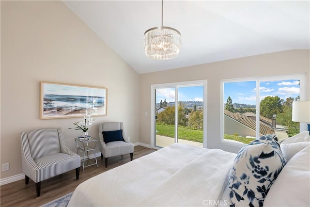 bedroom with wood finished floors, a chandelier, access to outside, baseboards, and lofted ceiling