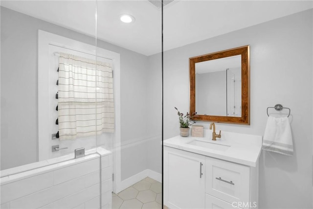 full bathroom with vanity, recessed lighting, baseboards, and tile patterned flooring