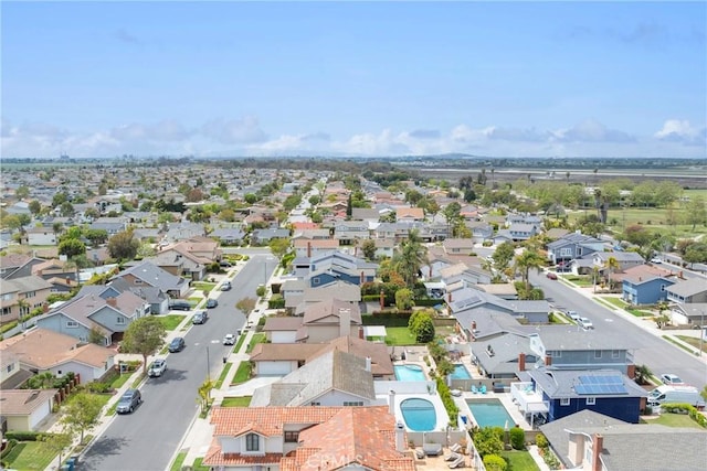 aerial view of residential area featuring a pool