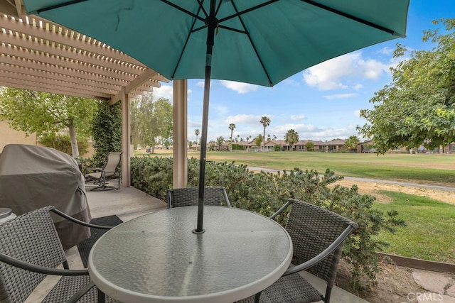 82689 Odlum Dr, Indio, CA 92201 - view of patio / terrace featuring a residential view, area for grilling, a pergola, and outdoor dining area