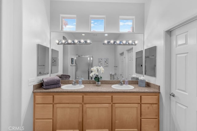 82689 Odlum Dr, Indio, CA 92201 - bathroom with double vanity, a shower stall, and a sink
