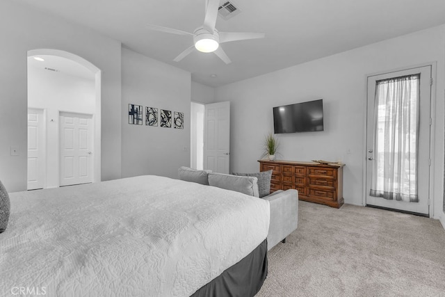82689 Odlum Dr, Indio, CA 92201 - bedroom featuring visible vents, ceiling fan, light carpet, arched walkways, and access to exterior
